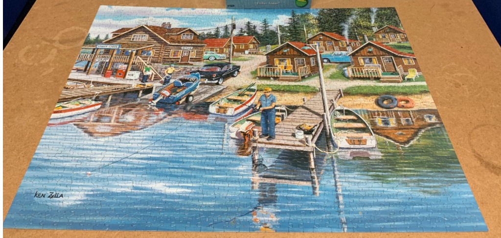 Illustration of a lakeside fishing resort with log cabins, boats, and a person fishing on a dock.