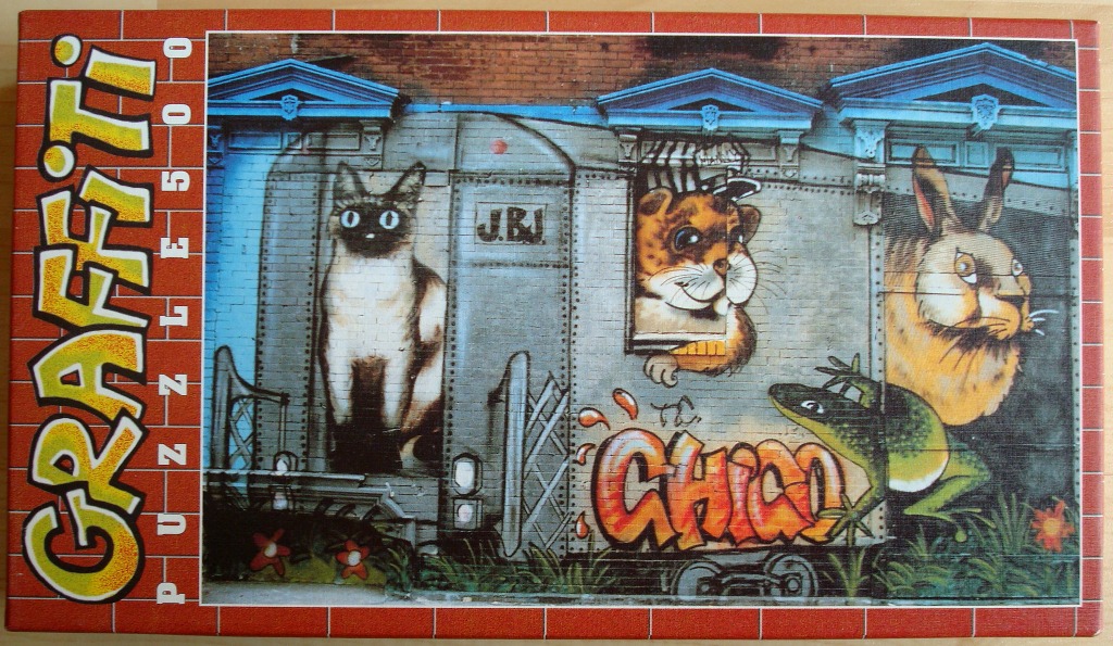 Graffiti-style mural featuring a cat, tiger cub, rabbit, and frog on a train car