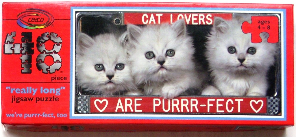 Three fluffy white kittens peering out from behind a red frame with the text CAT LOVERS ARE PURRR-FECT