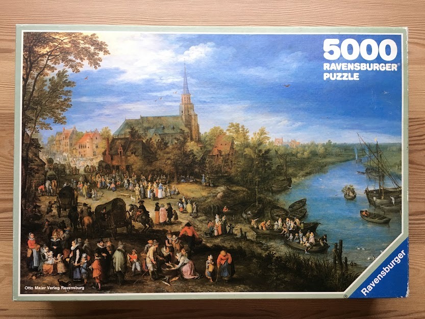 An old master oil painting of a busy riverbank scene featuring a village, church, and many people.