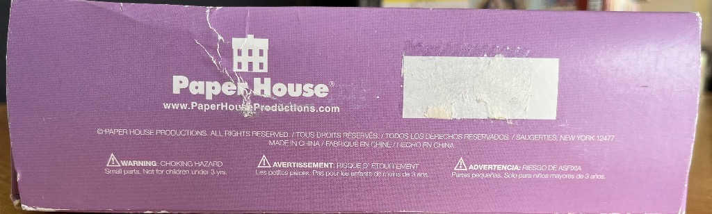 A solid purple background with white company branding, text, and safety warnings.