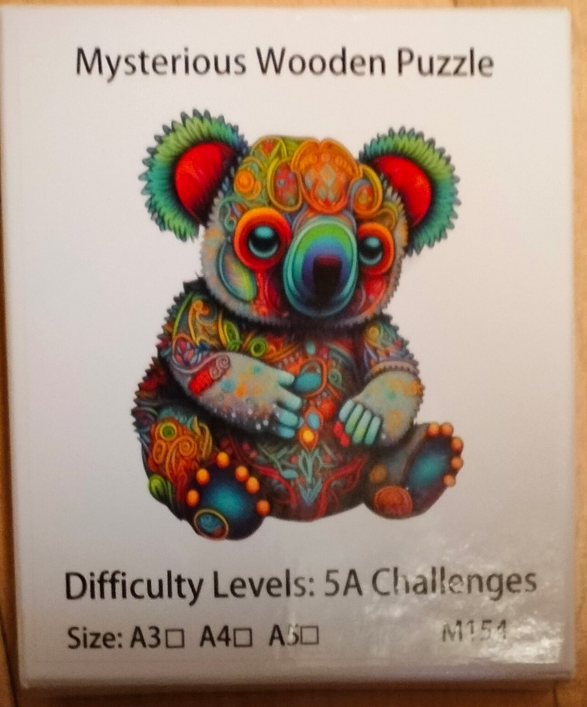 A whimsical illustration of a koala decorated with vibrant, psychedelic floral and swirling patterns.