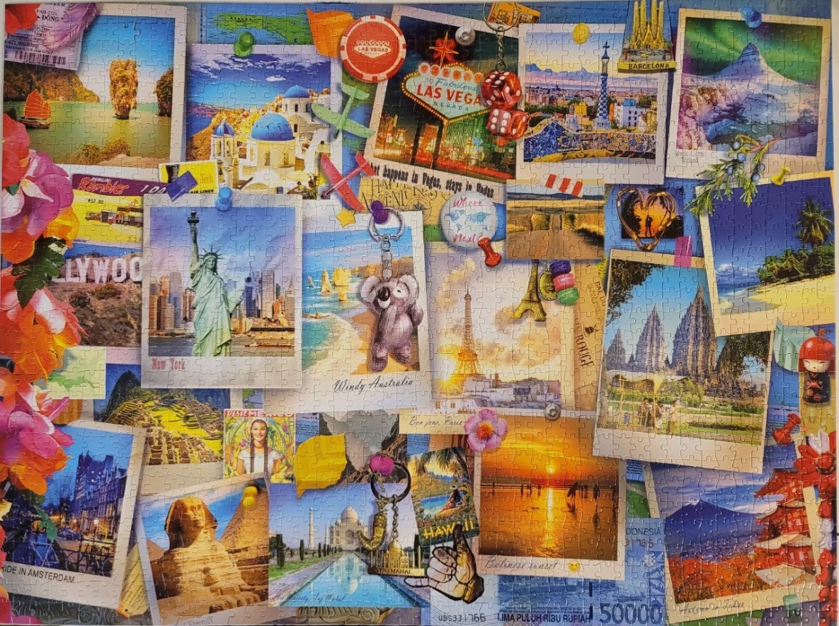 A collage of international travel photographs, postcards, and souvenirs pinned to a blue background.