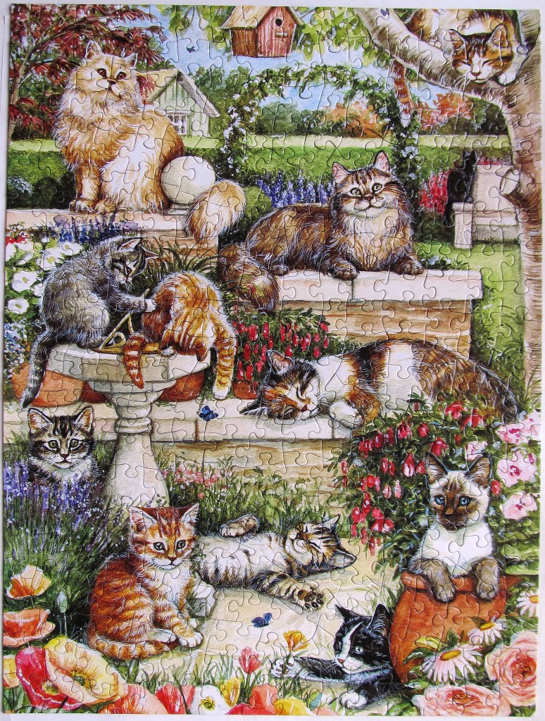 A whimsical garden scene filled with numerous cats and kittens playing and resting among colorful flowers.