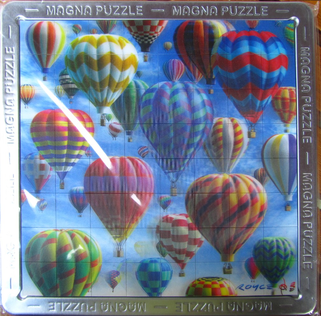 Colorful hot air balloons filling a blue sky