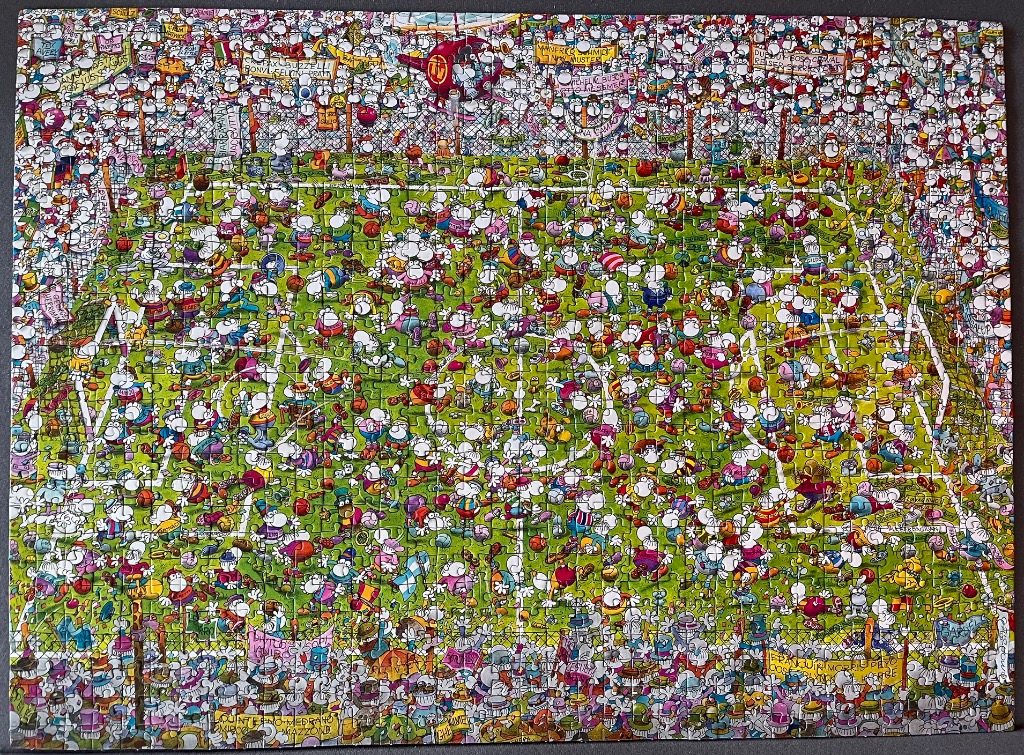 Cartoon illustration of an overcrowded, chaotic soccer field filled with many small, whimsical characters.