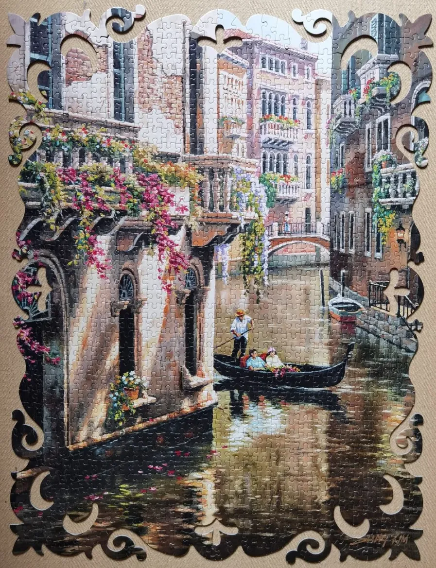 An impressionist-style painting of a Venice canal with a gondolier and passengers beneath an ornate decorative border.