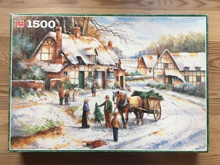 Winter village scene with a horse-drawn cart and families playing in the snow.