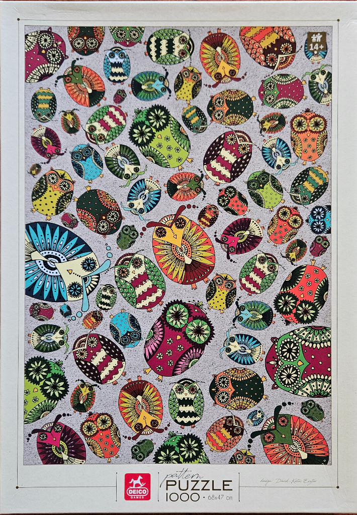 A whimsical illustration of many colorful, patterned owls scattered across a pale grey background.