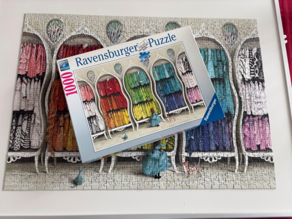 Illustration of a colorful wardrobe with dresses in rainbow hues.