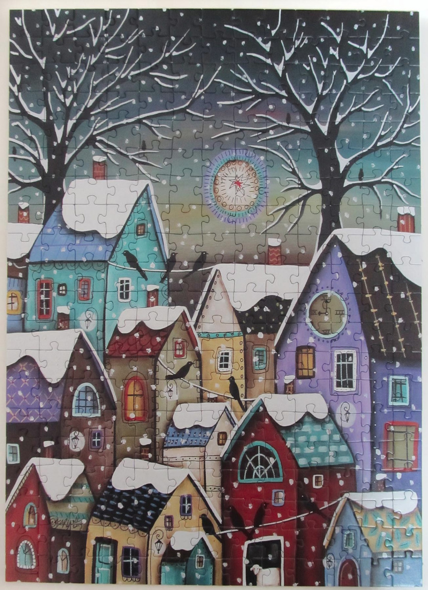 Whimsical folk art village in the snow with a glowing moon and silhouetted birds.