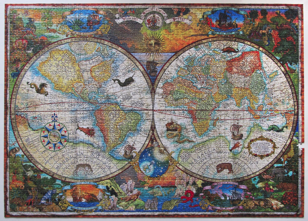 An antique-style double-hemisphere world map surrounded by ornate illustrations of mythical creatures and ships.