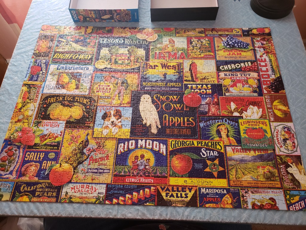 A collage of vintage fruit and vegetable crate labels featuring vibrant illustrations and typography.