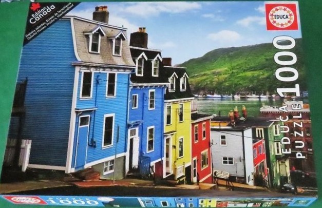 A row of colorful houses on a hillside overlooking a harbor in St. John's, Newfoundland.