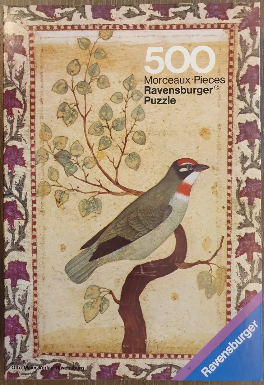 A vintage-style illustration of a bird perched on a branch within a decorative floral frame.
