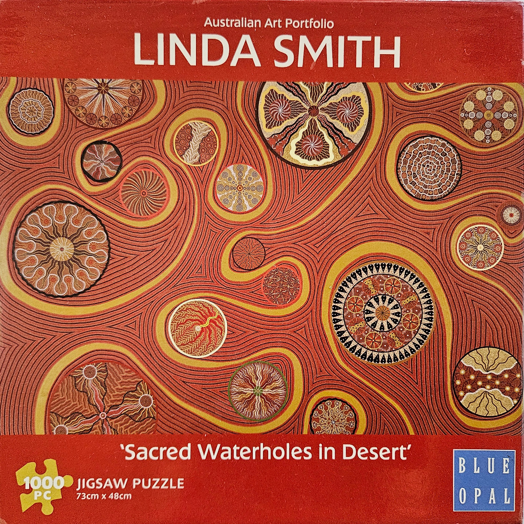 Indigenous Australian dot painting featuring circular waterhole motifs connected by flowing lines in warm desert tones.