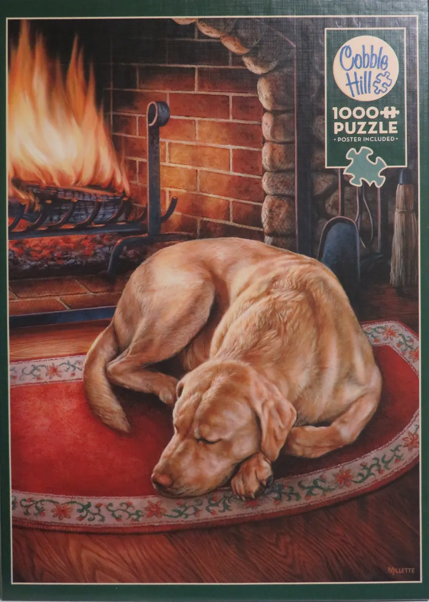 A golden Labrador retriever sleeping on a red rug in front of a roaring brick fireplace.