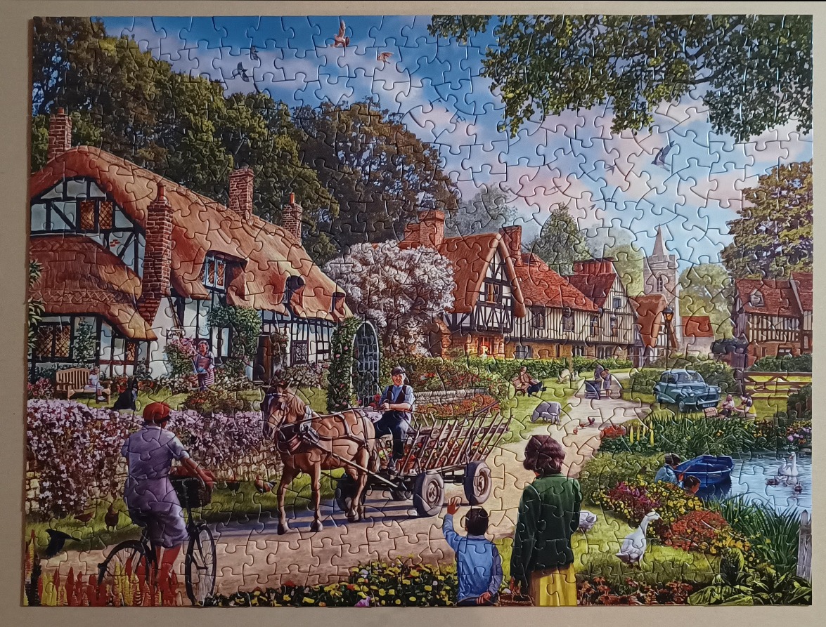 A peaceful English village scene featuring half-timbered cottages, a horse and cart, and a small duck pond.