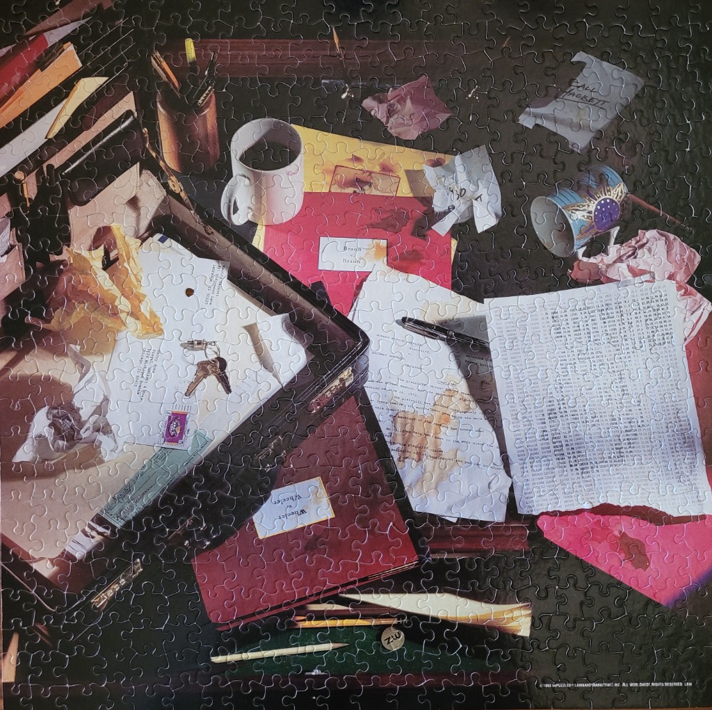 Vintage desk scene with papers, keys, coffee mug, and pencils.