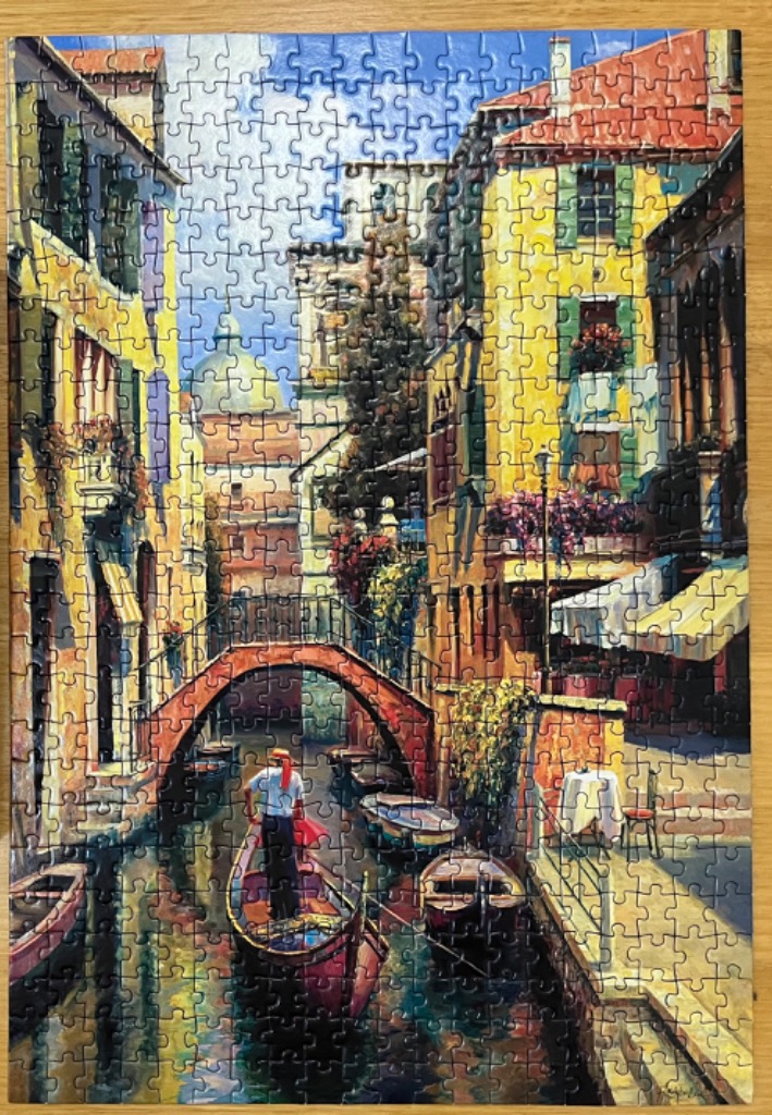 Impressionistic painting of a gondolier on a canal in Venice, Italy.