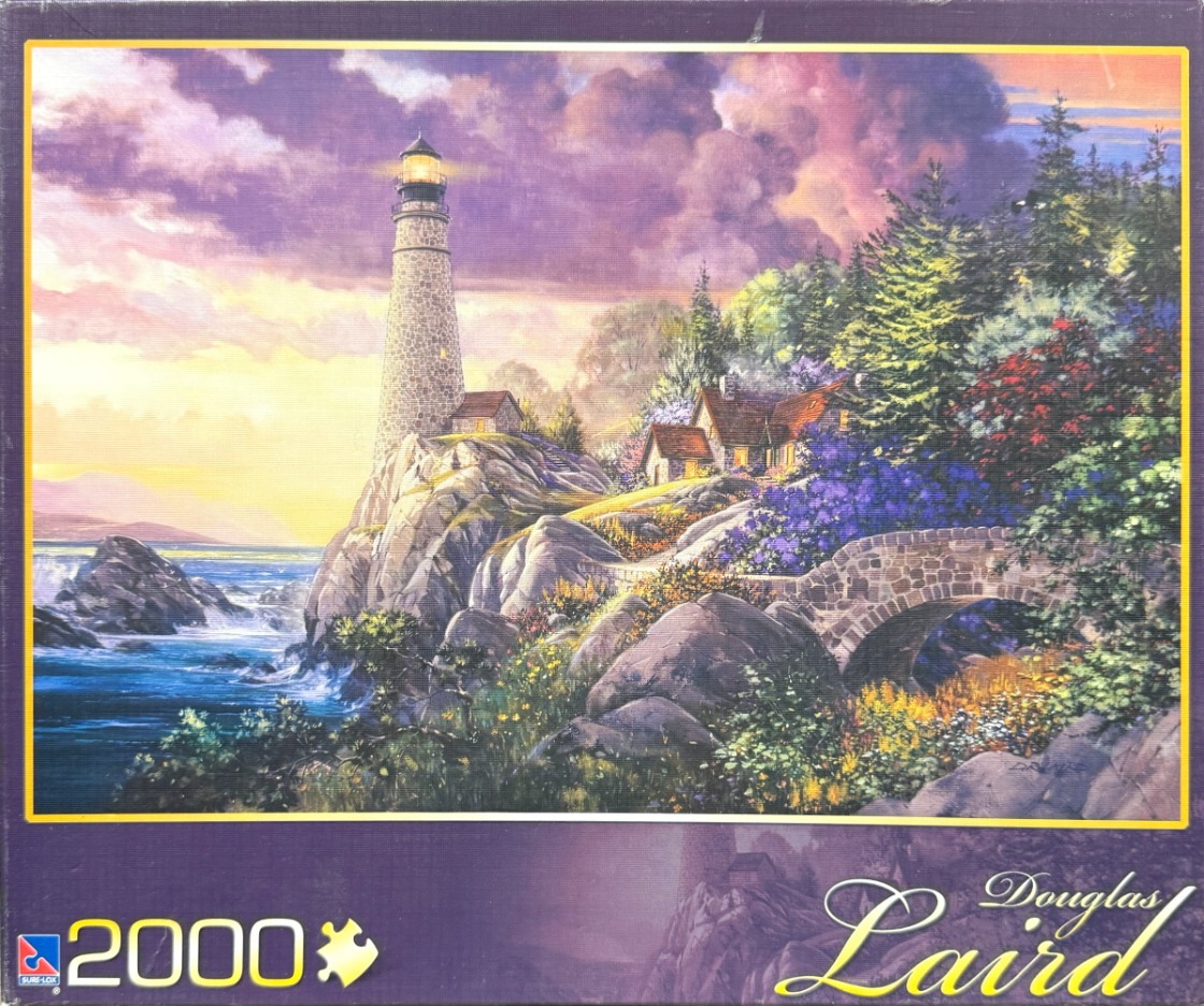 Painting of a stone lighthouse on a rocky cliffside at sunset with a stone bridge and cottage nestled in lush greenery.