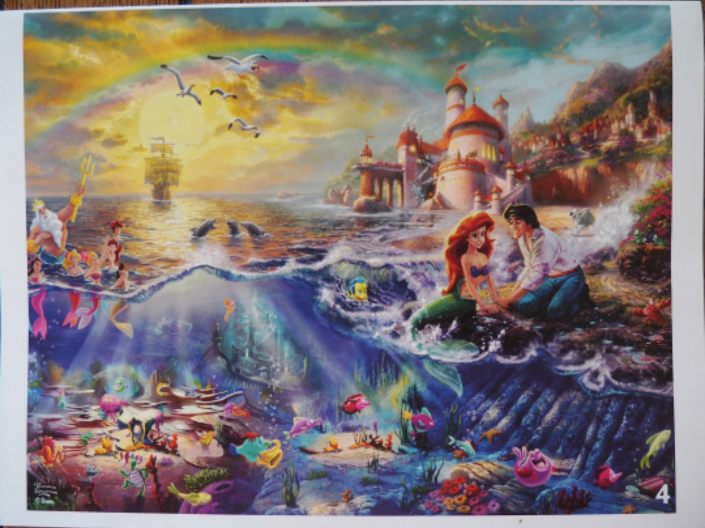A split-view illustration showing a mermaid with a prince on the shore and an underwater kingdom below.