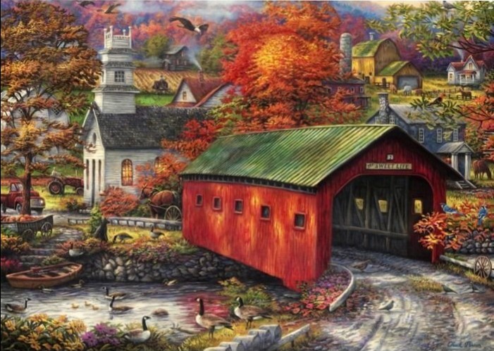A red covered bridge crosses a stream in an autumn village with a white church and colorful fall foliage.