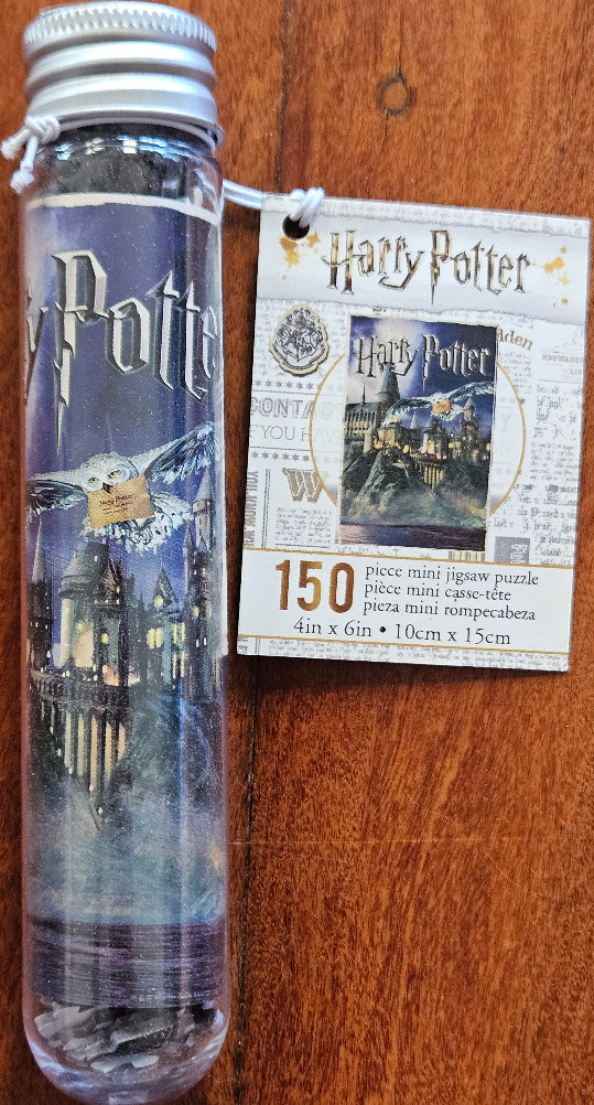 Harry Potter artwork featuring Hogwarts castle and the owl Hedwig flying above.