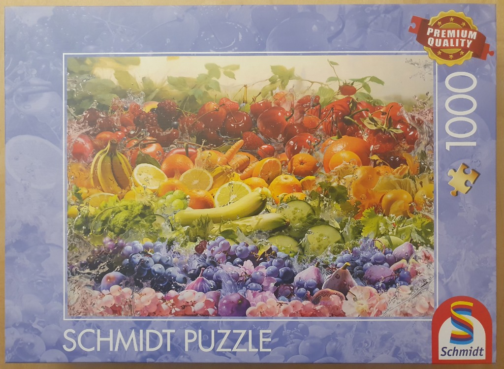 A colorful arrangement of fresh fruits and vegetables being splashed with water