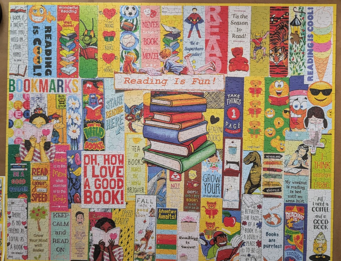 A collage of various colorful bookmarks featuring book-themed illustrations and inspirational quotes about reading.
