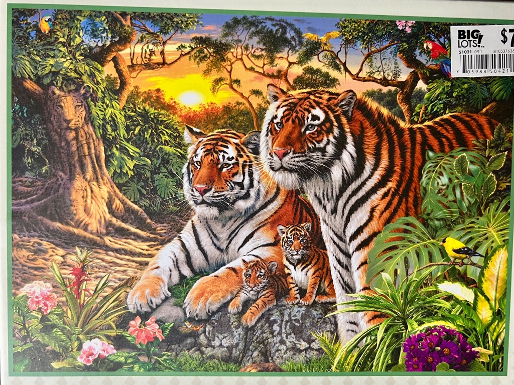 A family of tigers in a lush, sunlit tropical jungle.