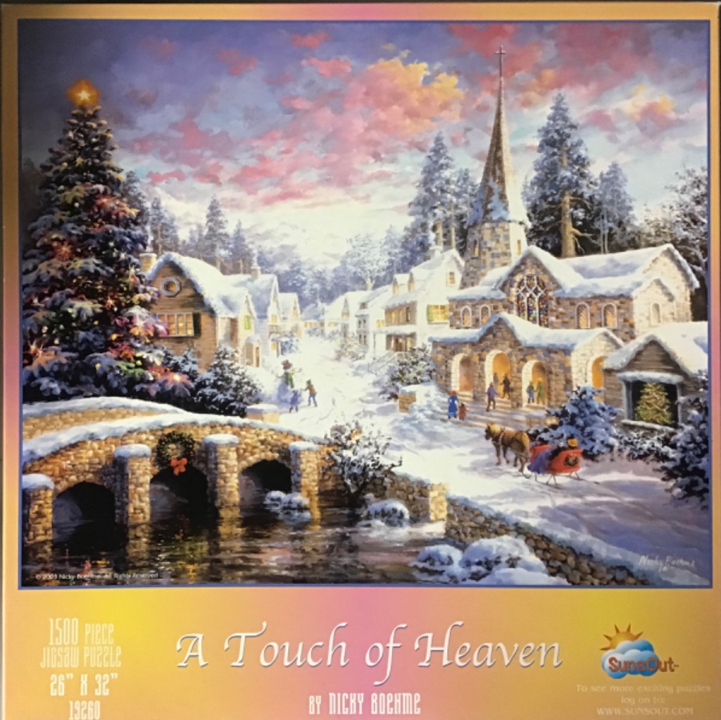 An idyllic snowy Christmas village scene with a church, a stone bridge, and a decorated tree at twilight.