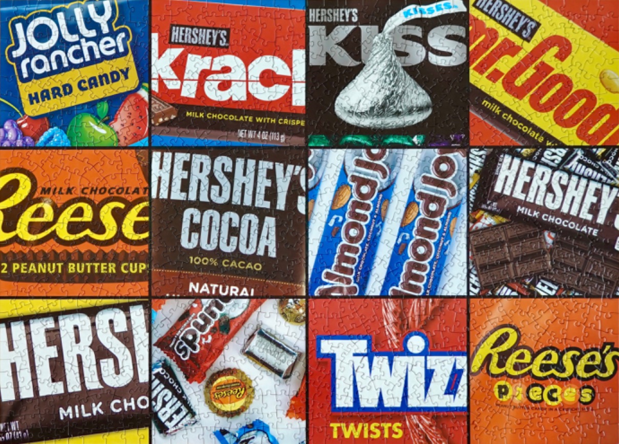 A collage of various candy and chocolate bar wrappers.