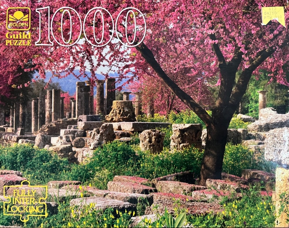 Ancient Greek stone ruins surrounded by blooming cherry blossom trees in spring