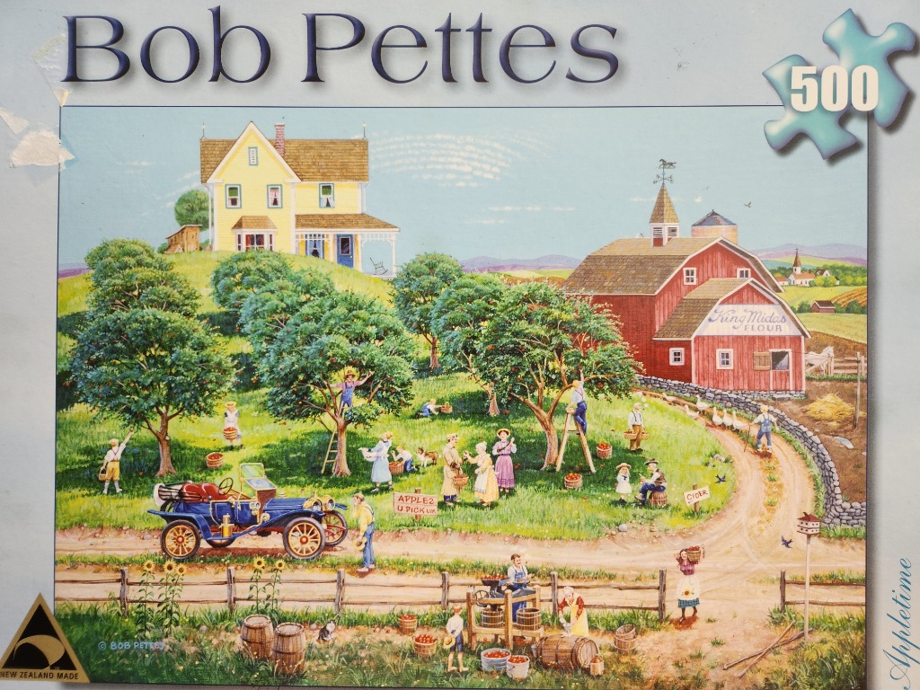 A nostalgic rural scene of people harvesting apples at an orchard with a yellow farmhouse and a red barn.