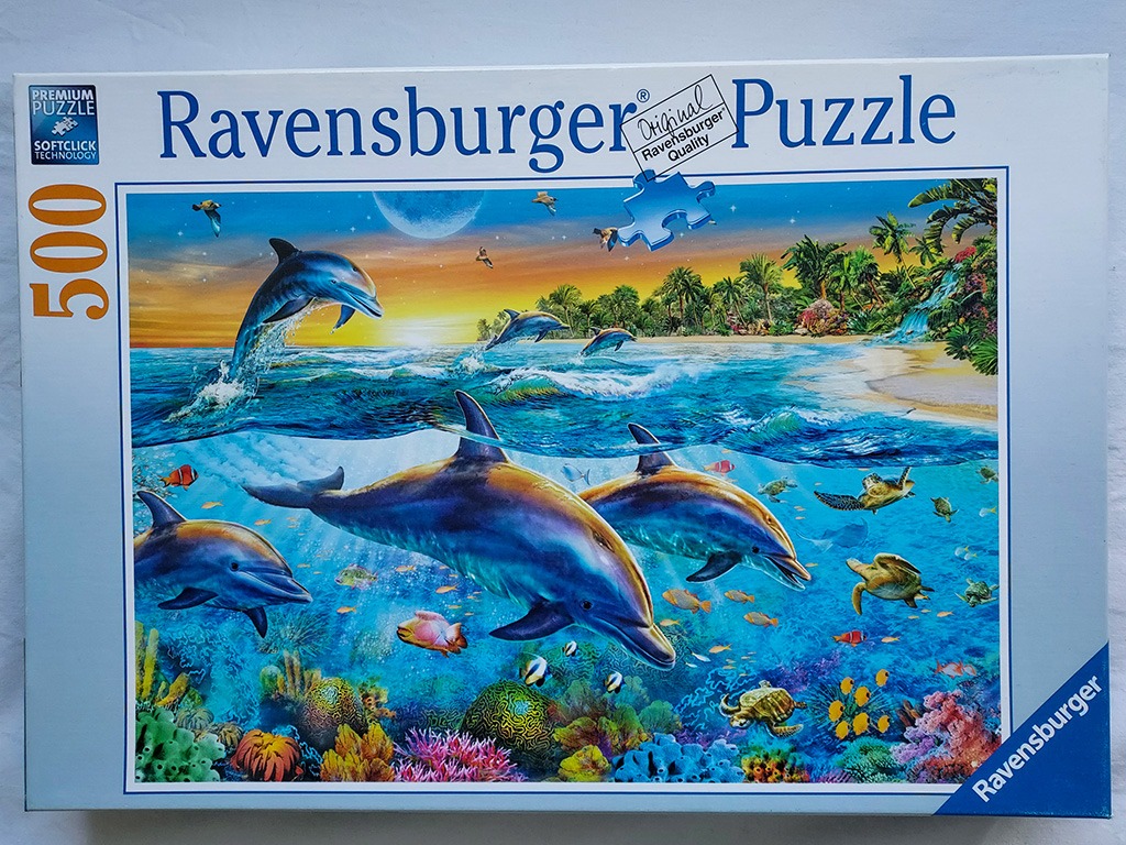 A tropical ocean scene featuring dolphins leaping and swimming among colorful coral reefs at sunset.