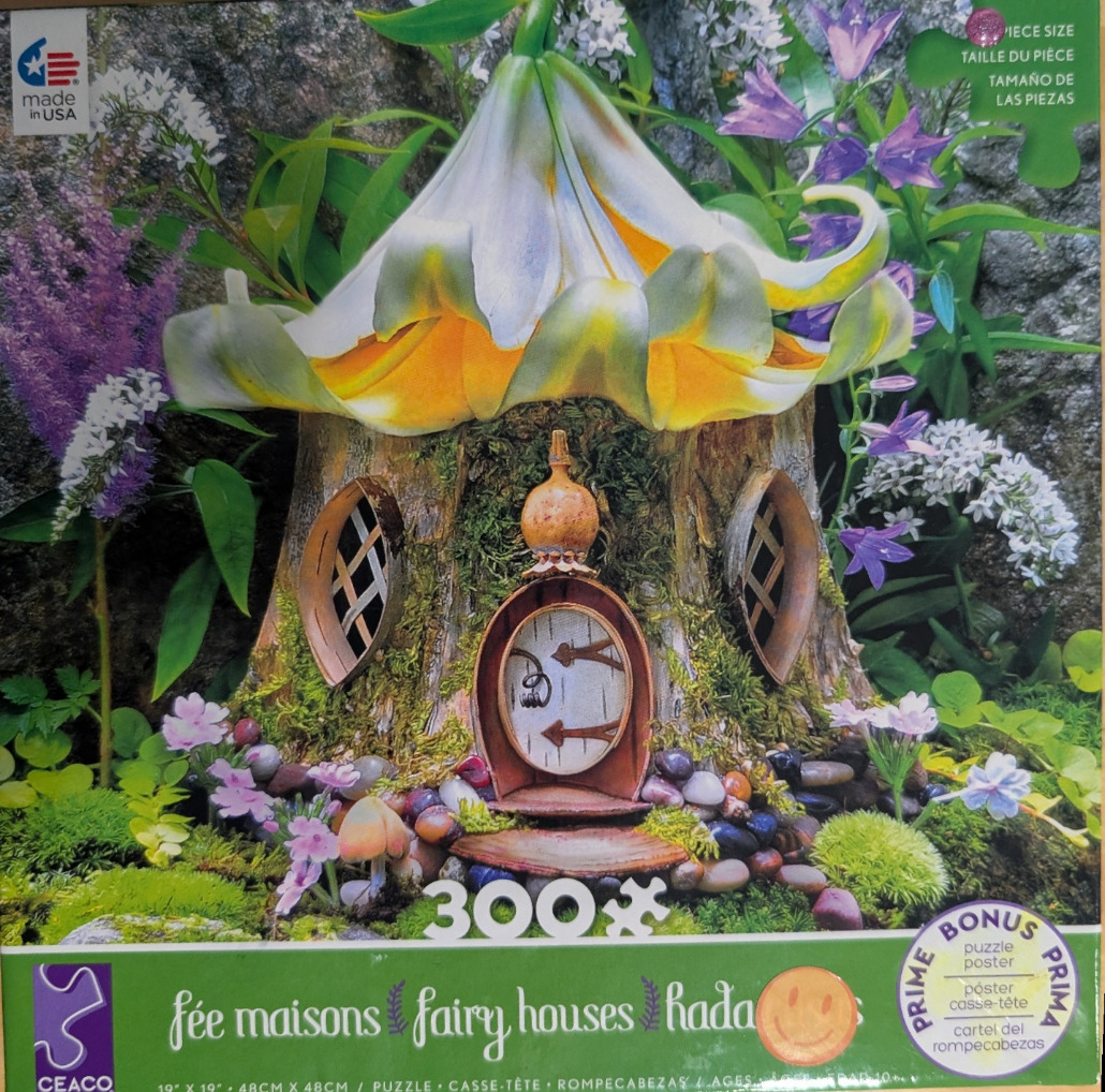 A whimsical fairy house built into a tree stump topped with a large, glowing lily flower.