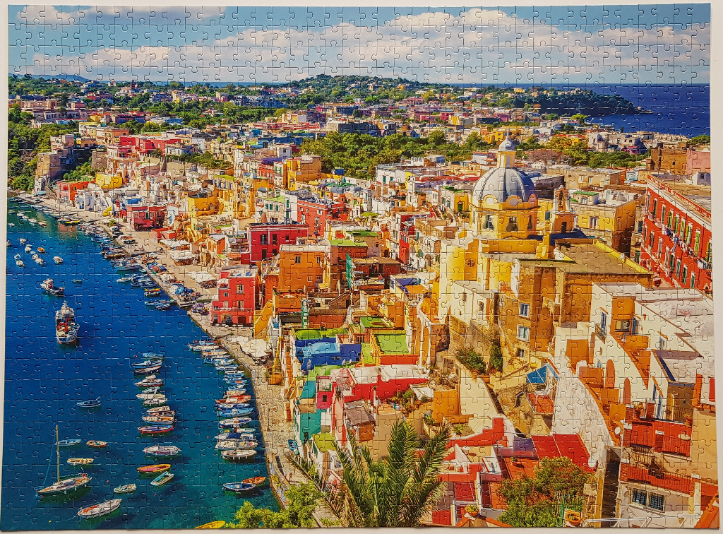 A high-angle view of the colorful Mediterranean harbor of Corricella on Procida island, Italy.