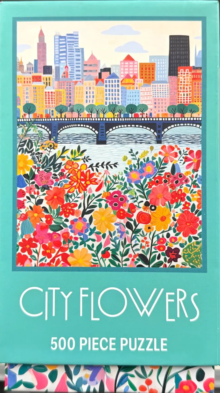 A whimsical illustration of a dense field of vibrant flowers in the foreground with a city skyline and bridge behind.