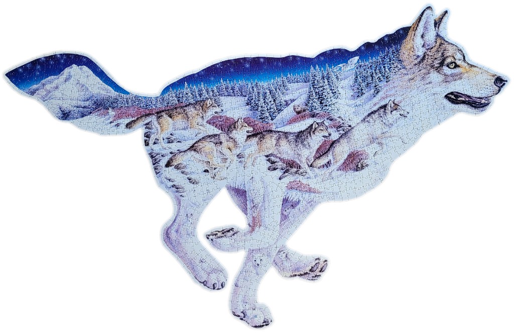 A die-cut image of a running wolf, filled with a scenic landscape of a wolf pack in a snowy, star-lit forest.