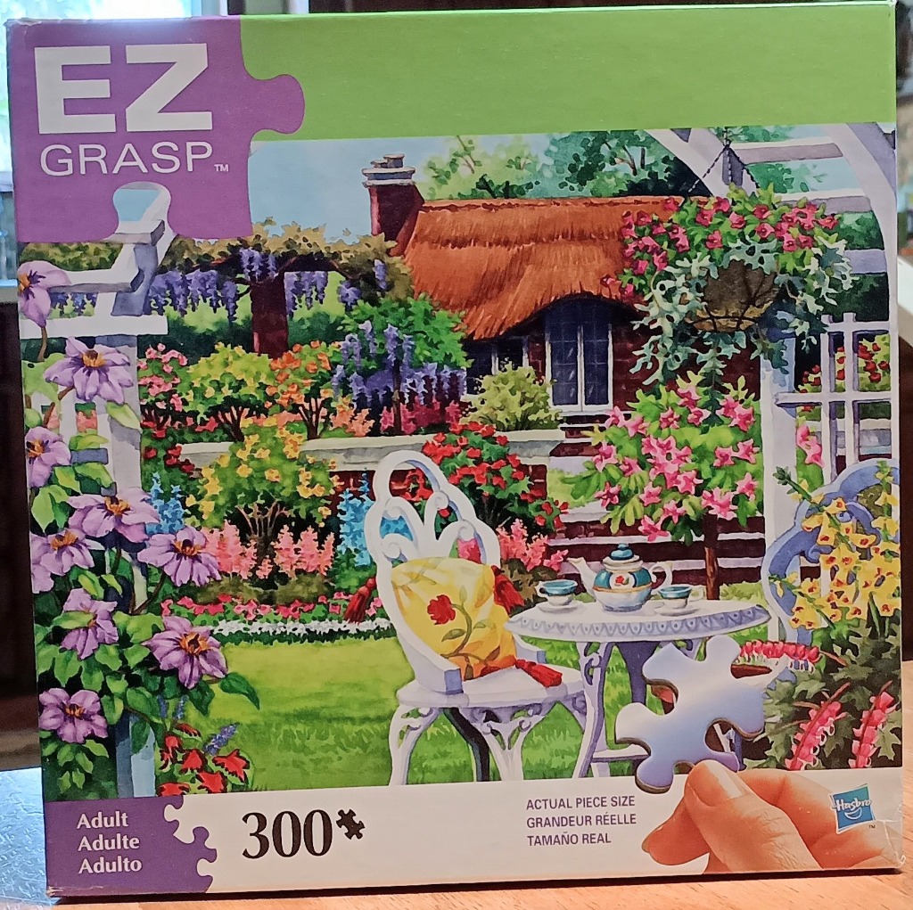 A peaceful English garden scene featuring a thatched cottage, tea set, and floral trellis.