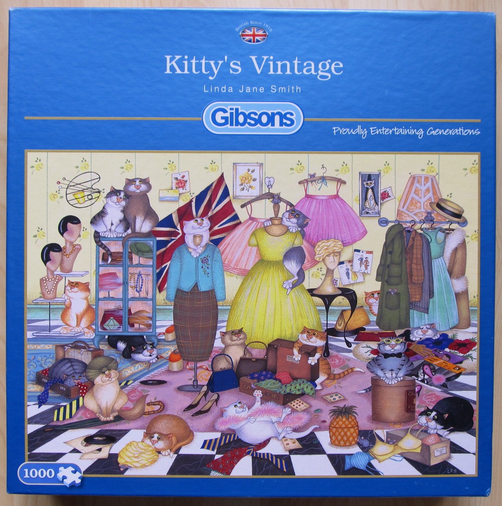 Illustration of many cats playing in a vintage boutique filled with clothes, hats, and luggage.