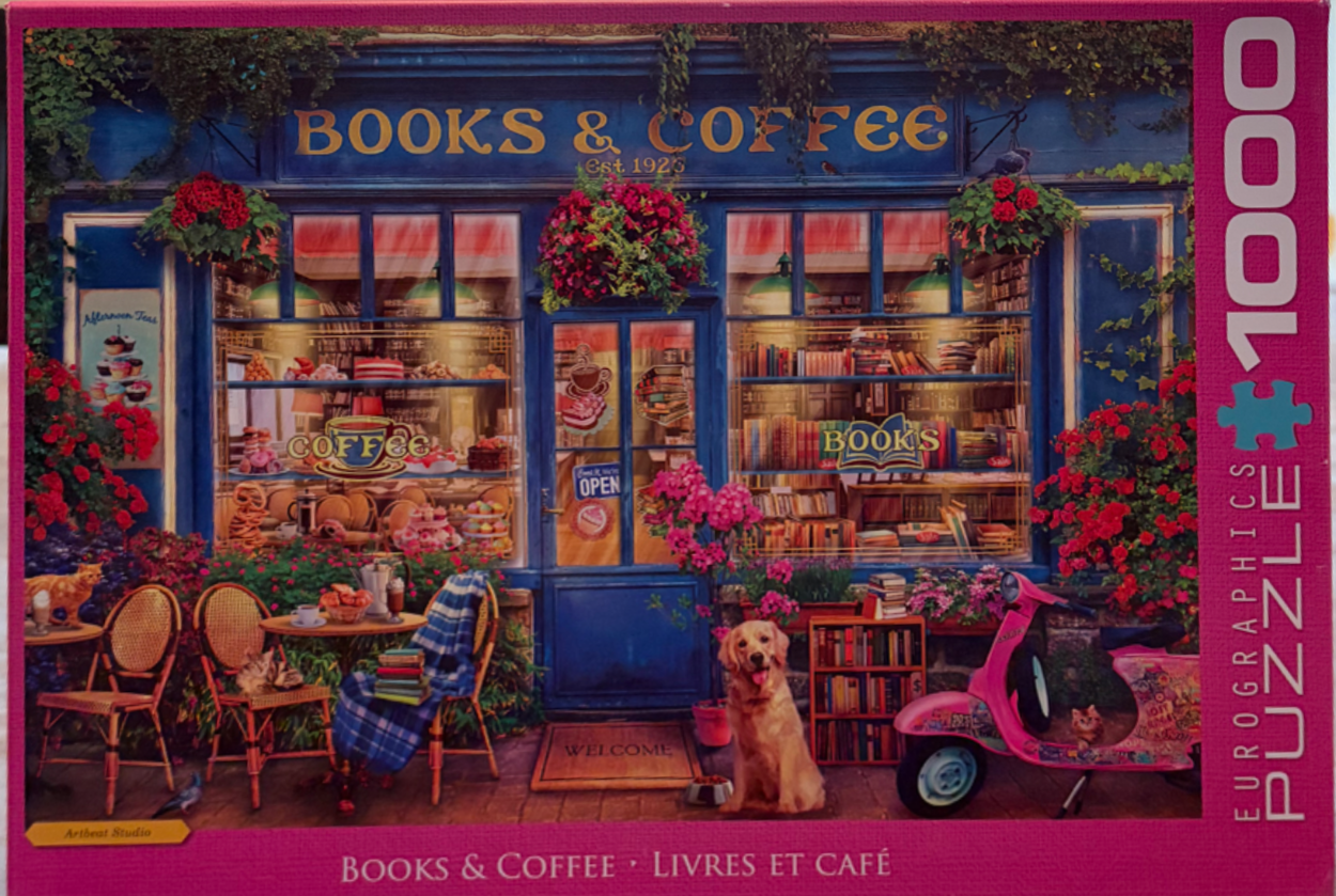 A cozy storefront called Books & Coffee with a golden retriever, cats, and a pink scooter in front.