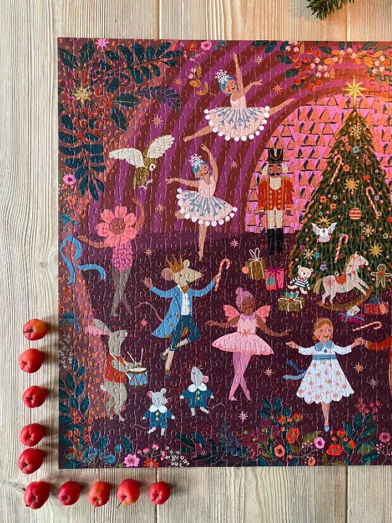 A whimsical Nutcracker-themed Christmas illustration featuring dancers, toys, and a decorated tree in vibrant colors.