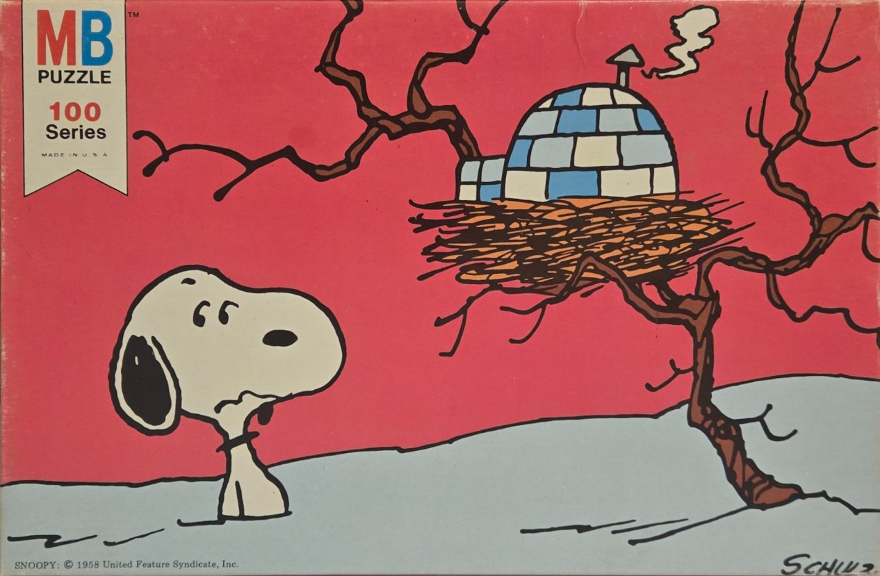 Snoopy looking up at a nest containing an igloo in a tree against a red sky.