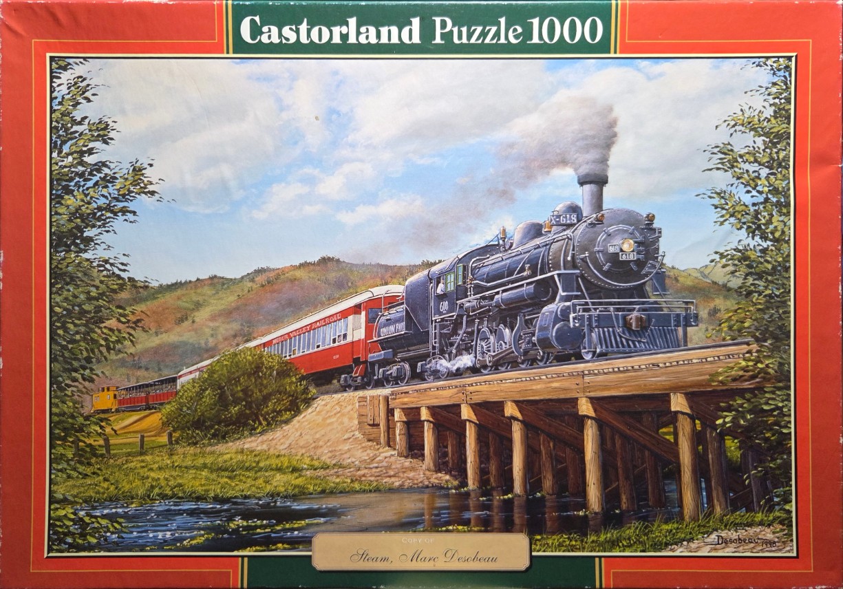 A steam locomotive pulling passenger cars over a wooden trestle bridge across a stream in a rural landscape.