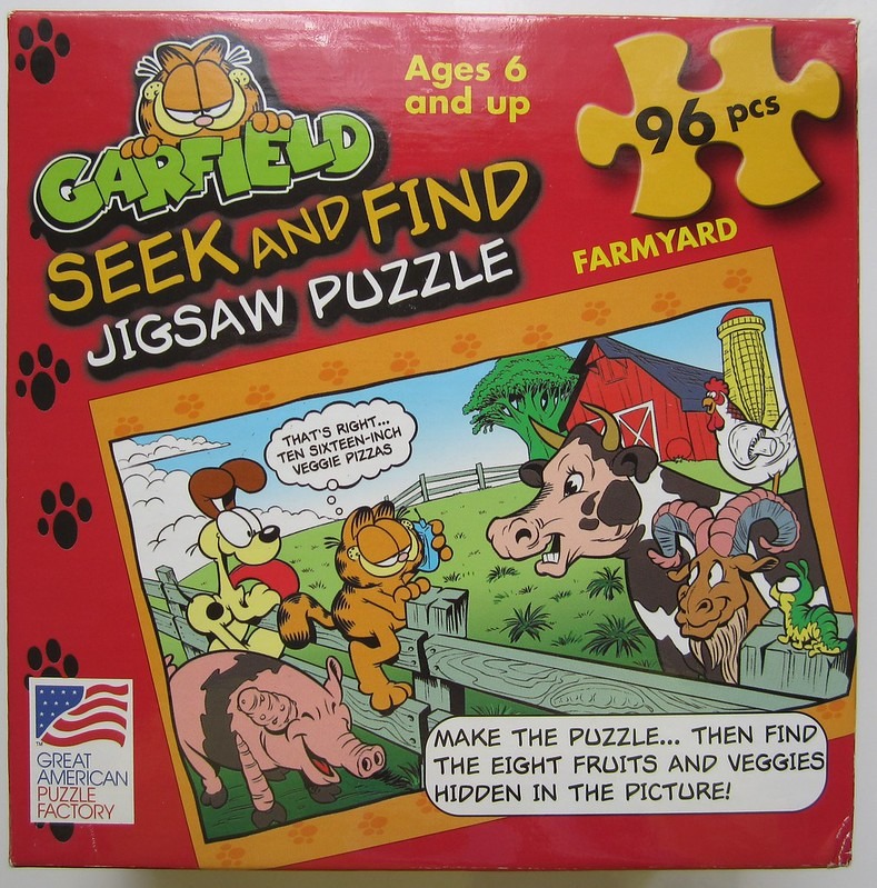 Cartoon illustration of Garfield the cat and other farm animals in a field on a farm with a red barn.