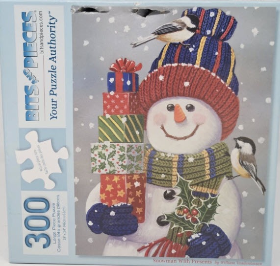 A whimsical illustration of a snowman wearing a hat and scarf, holding a stack of colorful Christmas gifts.