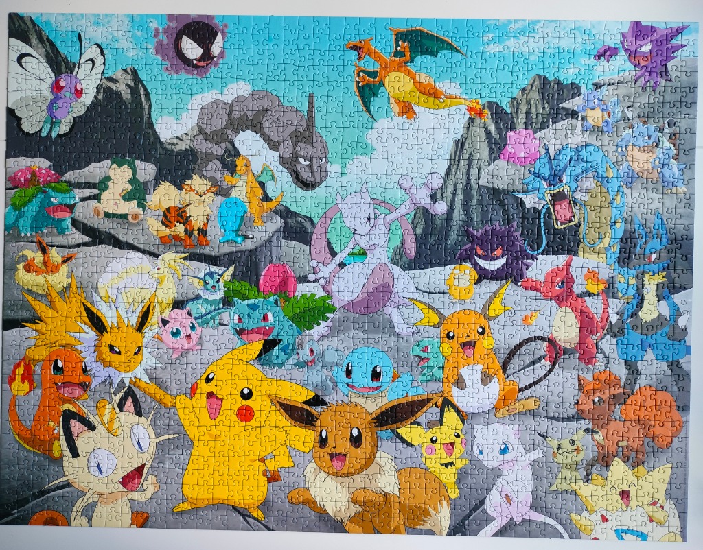 A crowded illustration featuring many different Pokémon characters in a rocky, mountainous landscape.