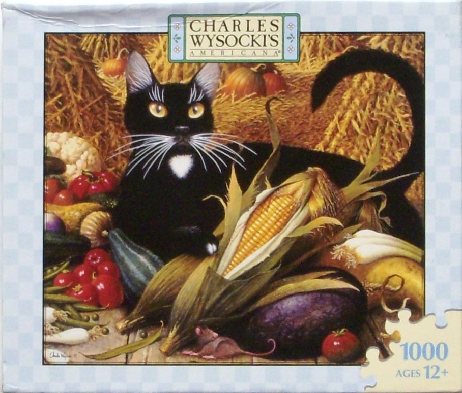 A black cat with a white patch sits among a harvest of corn, pumpkins, and vegetables with a small mouse nearby.